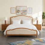 Elegant upholstered solid wood platform bed with curved headboard and footboard in natural wood finish for modern bedroom décor.