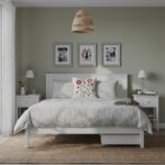 Modern white wooden platform bed with integrated pull-out storage drawer, minimalist panel headboard, and contemporary bedroom design.