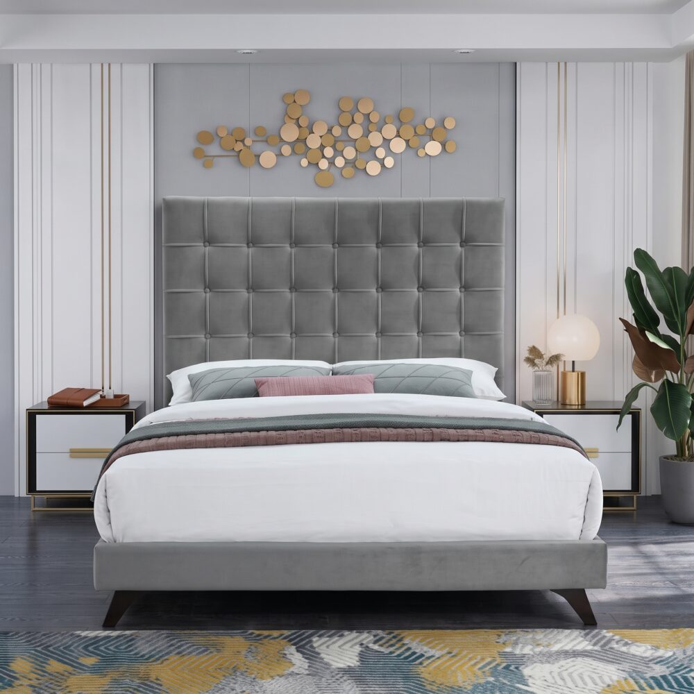 Luxury grey velvet upholstered platform bed with a tall square tufted headboard in a contemporary modern bedroom setting.