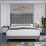 Luxury grey velvet upholstered platform bed with a tall square tufted headboard in a contemporary modern bedroom setting.