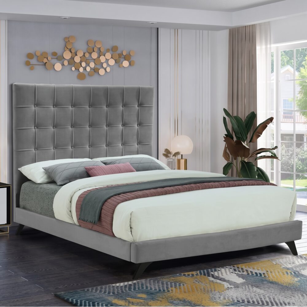 Luxury grey velvet upholstered platform bed with a tall square tufted headboard in a contemporary modern bedroom setting.