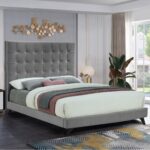 Luxury grey velvet upholstered platform bed with a tall square tufted headboard in a contemporary modern bedroom setting.