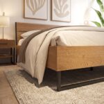 Modern rustic wooden platform bed with a natural oak finish, black metal frame, and minimalist industrial design in a contemporary bedroom.