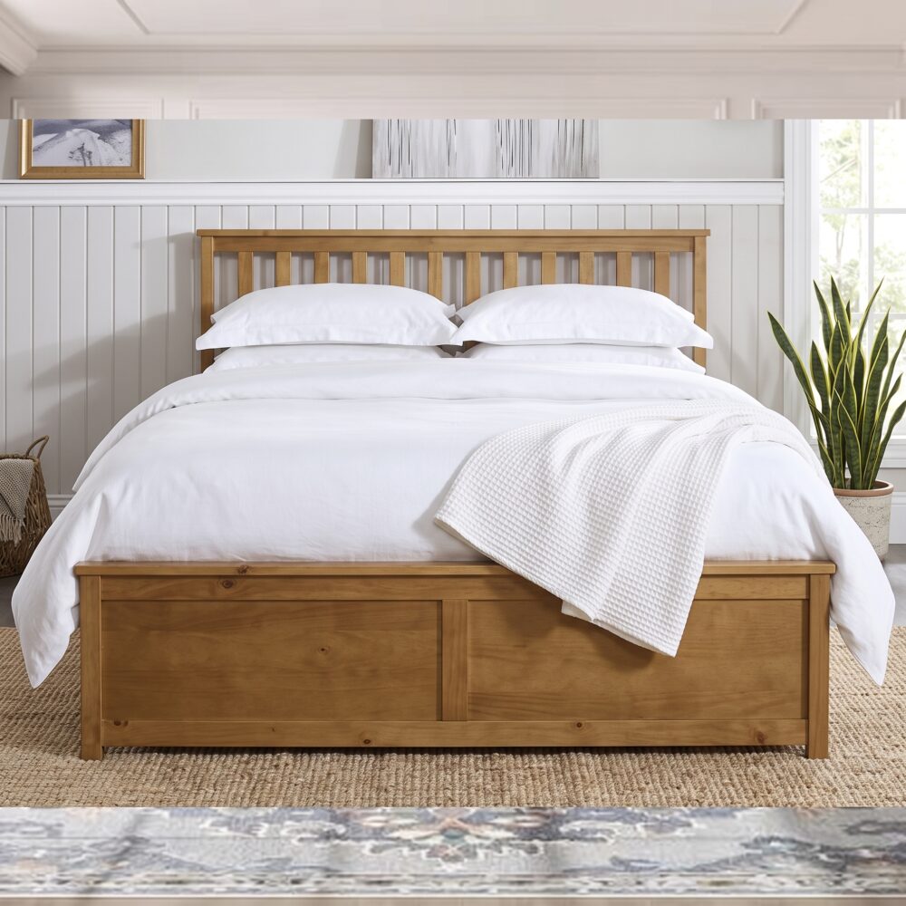 Modern natural wood platform bed with slatted headboard and storage-style base in contemporary bedroom.