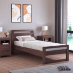 Modern walnut wooden platform bed with minimalist open headboard and sturdy frame in a contemporary bedroom.