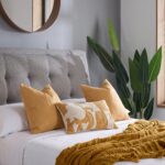 Modern gray upholstered platform bed with padded headboard and four pull-out storage drawers in a contemporary bedroom.