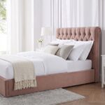 Luxury blush pink velvet upholstered platform bed with diamond button tufted headboard, modern bedroom furniture, and elegant contemporary design.