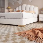 Luxury white upholstered platform bed with a scalloped padded headboard, gold trim accents, modern designer bedroom furniture, and contemporary upholstered frame.
