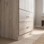 Modern 4-door wooden wardrobe with two bottom drawers in a light oak finish for bedroom storage.