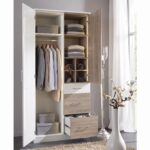Modern white and oak wardrobe featuring two doors, hanging rail, storage shelves, cubbies, and three spacious drawers for bedroom organization.