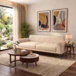 Modern Cream Fluted 3-Seater Sofa with vertical channel tufting, premium cream fabric upholstery, curved armrests, and solid wood base in a contemporary living room.