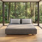 Modern grey fabric sofa cum bed converted into a spacious sleeper bed with dual side storage pockets, premium upholstery, high-density foam cushions, and contemporary design for living room or guest room.