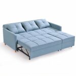 Modern light blue fabric pull-out sofa cum bed with tufted cushions, three removable back pillows, sturdy metal sleeper frame, and wooden legs for contemporary living rooms.