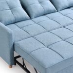Modern light blue fabric pull-out sofa cum bed with tufted cushions, three removable back pillows, sturdy metal sleeper frame, and wooden legs for contemporary living rooms.