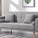 Modern grey fabric convertible sofa bed with tufted backrest, wooden legs, square cushions, bolster pillows, and Scandinavian design for living room furniture.