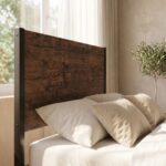 Rustic wood and matte black metal single bed frame styled with neutral beige bedding and waffle throw blanket.