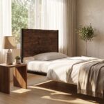 Rustic wood and matte black metal single bed frame styled with neutral beige bedding and waffle throw blanket.